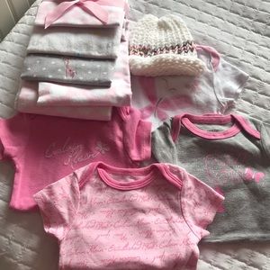 Onesies, receiving blanket, knitted hat.